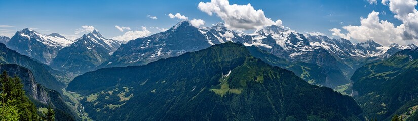 Switzerland, Panoramic view on green Alps, Eiger, Monch and Jungfrau peaks from Schynige Platte