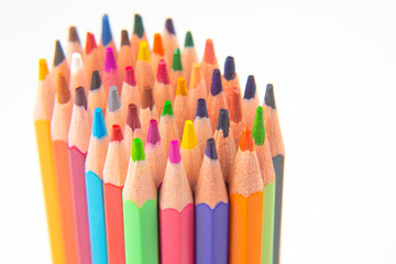 Colored pencils for drawing on a white background. Education and creativity. Leisure and art