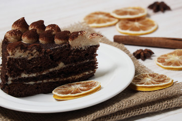 Slice Tiramisu Cake on a white plate.
