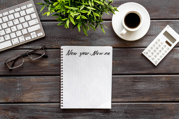 Bucket list. Blank notebook to write goals and wishes on dark wooden office desk top-down mockup