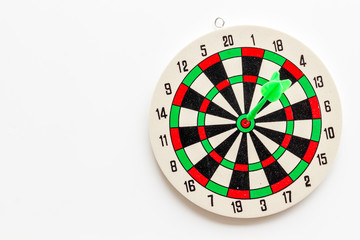 Darts game - simple sport for lesure time. Dartboard and arrows or dart on white background top...