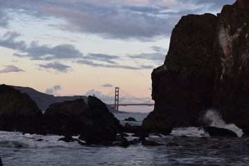 Golden Gate Bridge from Lands End in San Francisco under a cloudy sky during daytime - Powered by Adobe