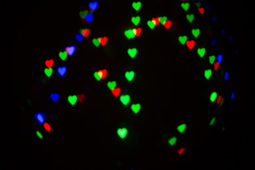 Colorful abstract heart shape blured bokeh at night