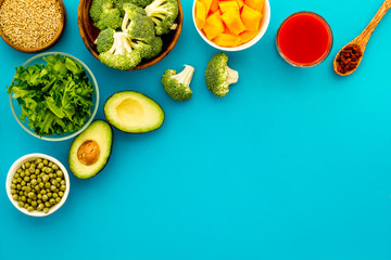 Diet program concept. Set of fresh vegatables and fruits on blue background top view frame copy space