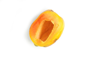 Half ripe papaya fruit without seeds isolated on white background. Top View food concept.