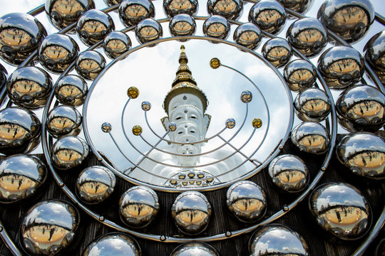 Images of Buddha amulet, Mercury statue and Thai temple