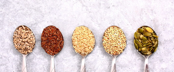Spices in spoons on the table.