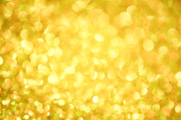 Luxury gold glitter with bokeh background, de-focused. concept for chrismas, holiday, happy new year, festive decoration.