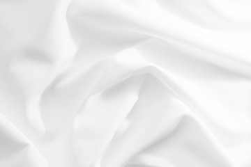 Abstract white fabric texture background. Cloth soft wave. Creases of satin, silk, and cotton.	