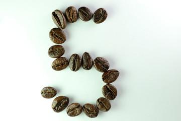 Coffee Been, the number five is formed with coffee beans in white background