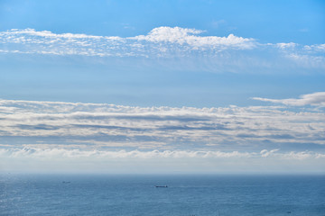 Cargo ship in the distrance on a calm sea