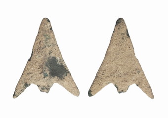 view of ancient metal arrow covered with green patina isolated on white background, Prehistoric period, iron age 1500-3500 BCE., Lopburi, Thailand.