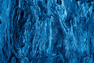 Top view of dark stone background in blue color.