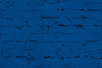 Modern brick wall texture for background in color of the year 2020 classic blue