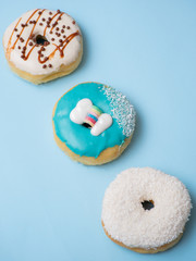 Flat lay of donut on blue background