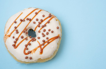 Flat lay of donut on blue background