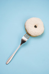 Flat lay of donut on blue background