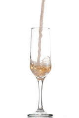 pouring white wine, champagne into a tall glass, strong flow and splash