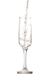 pouring white wine, champagne into a tall glass, strong flow and splash