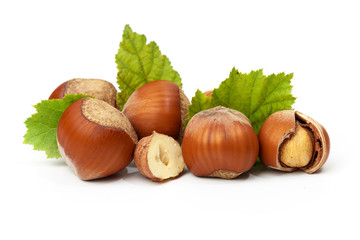 Hazelnut nut many leaves isolated on a white background as a packaging design element