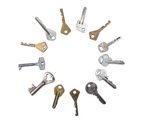 Background of assorted old multi-colored metal antique keys of different shapes. Home security concept.