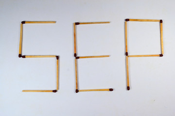 letter Sep for September with matches in white background