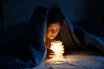 magical mysterious child with can with garland,
