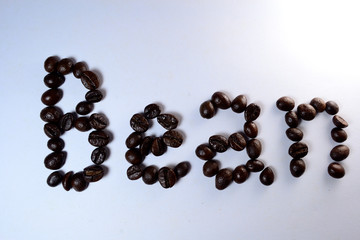Coffee Beans, the letter of bean is formed with coffee beans in white background