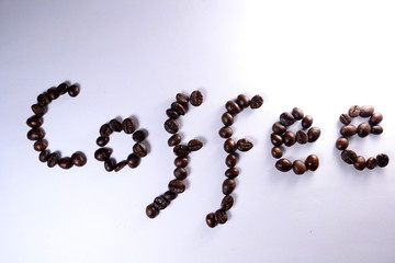 Coffee Coffee, the letter of bean is formed with coffee beans in white background