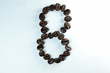 Coffee Been, the number eight is formed with coffee beans in white background