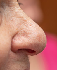 Naklejka premium light skin female nose as background