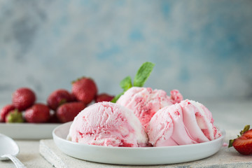 Homemade strawberry vanilla ice cream with fresh strawberries. Sweet berry summer dessert. Concrete...