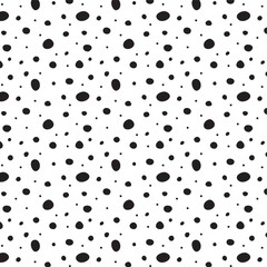 Polka dot seamless background with hand drawn doodle shapes. Irregular abstract texture with random dots, circles, animal skin.