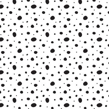 Polka dot seamless background with hand drawn doodle shapes. Irregular abstract texture with random dots, circles, animal skin.