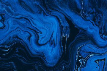 Fototapety  Hand painted background with mixed liquid blue and golden paints. Classic blue color of the year 2020. Abstract fluid acrylic painting. Marbled blue abstract background. Liquid marble pattern