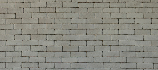 Rustic gray grunge brick wall texture background.