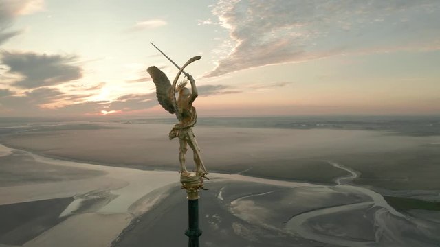 Drone Footage of the statue above Saint Mont Michel, France, 2019.