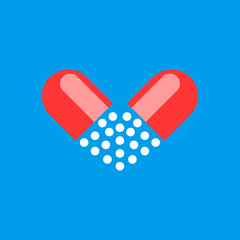 Pharmaceutical medicine pills and capsules in the shape of a heart on a blue background.