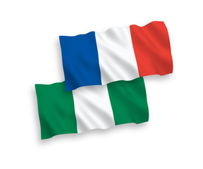 National vector fabric wave flags of France and Nigeria isolated on white background. 1 to 2 proportion.