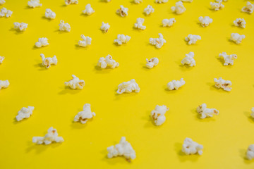 low angle view of popcorn in Pattern Lines on a  yellow background