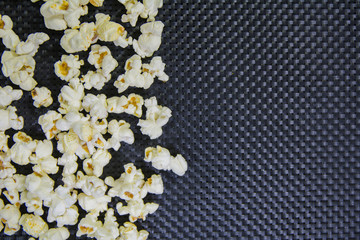 side spread popcorn on a textured black background