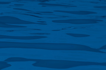 Background blue water surface.