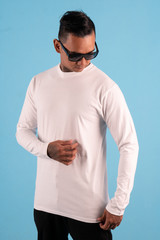 Black man wearing white long sleeve t-shirt and sunglasses front view