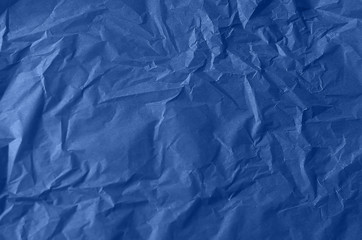 Obraz premium Textured crumpled paper in blue. Background for your design. Tinted paper.