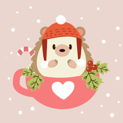 The character of cute hedgehog sitting in the pink cup with holly leaf and candy. The cute hedgehog wear a winter hat on the pink background and white snow.