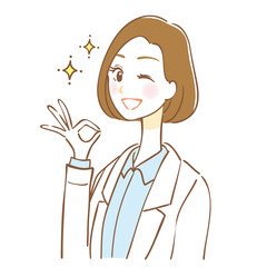 Fototapeta premium A woman wearing a white coat is giving an OK sign
