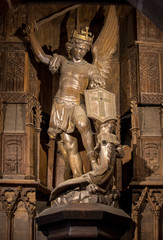 Statue of Saint Michel killing the dragoon in Saint Pierre parish church. Mont Saint Michel, France