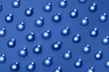 Christmas small balls to decorate the Christmas tree. blue background.