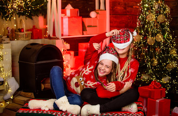Obraz na płótnie Canvas Capturing a happy moment. happy small girls has xmas mood. Enjoying New Year party. santa children spend holiday. Opening Christmas present. winter shopping sale kid store. Little Christmas magic