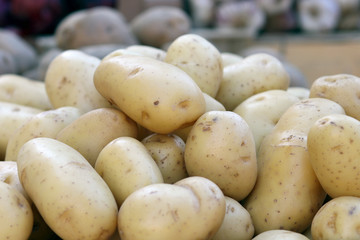 Potatoes in wooden box on the market